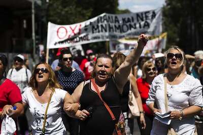 Protesters throw petrol bombs as Greek Parliament debates bailout