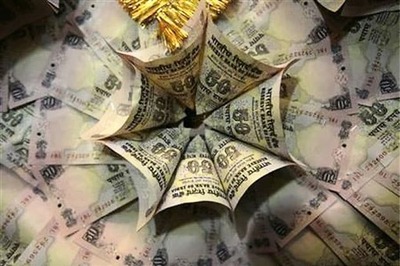 Rupee down 27 paise against dollar