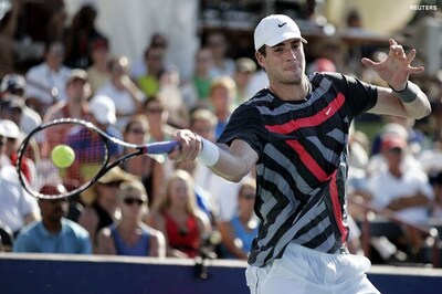 US Open: Marathon man Isner wins easily