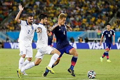 World Cup: Ten-man Greece hold Japan to a goalless draw