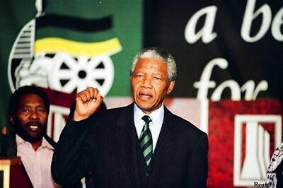 South Africa's Mandela improving as Obama flies in