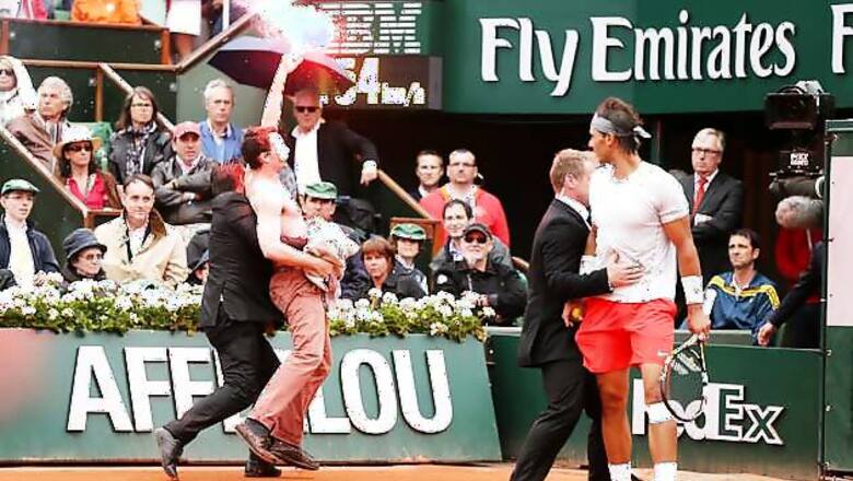 Protesters, one letting off a flare, interrupt French Open final