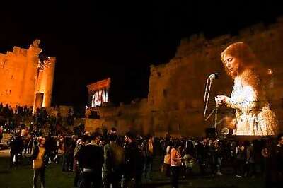 Macron Reassures Protesters After Meeting Lebanon's Symbol Of Unity, Singer Fairouz