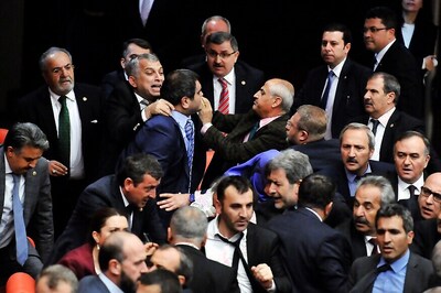 Turkish Lawmakers Exchange Punches, Hurl Bottles in Parliament