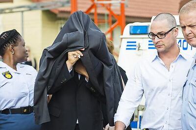 Blade runner Pistorius cries as murder charge read out