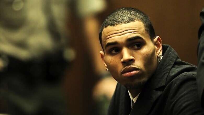 Rapper Chris Brown's bodyguard confesses to punching a man who tried to board Brown's tour bus