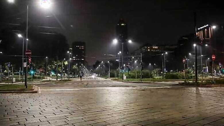 AP PHOTOS: New Virus Curfew Brings Silence To Milan Streets
