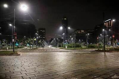 AP PHOTOS: New Virus Curfew Brings Silence To Milan Streets