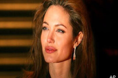 Jolie flies to Hanoi for son's visa
