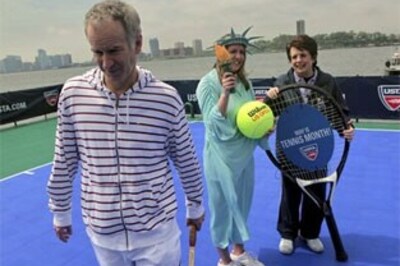 King, McEnroe play tennis on floating court