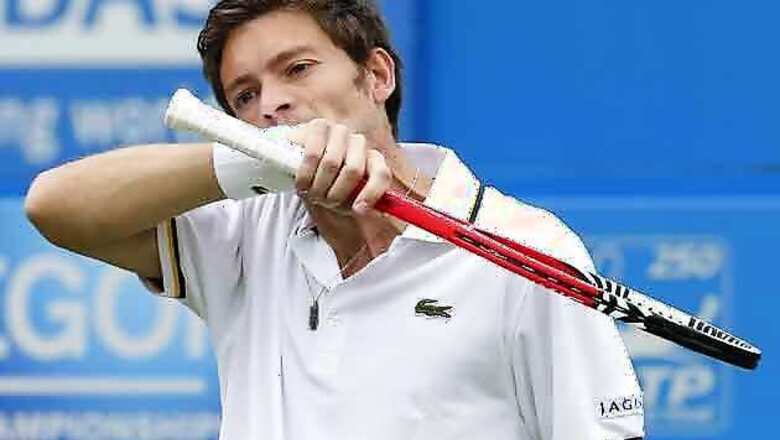 Defending champ Mahut ousted by Groth at Newport
