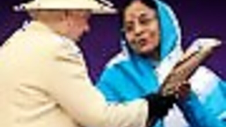 Pics: Queen hands over Commonwealth baton to Prez