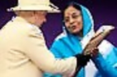 Pics: Queen hands over Commonwealth baton to Prez