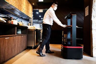 A.I. Robot Serves Customers At Seoul Restaurant
