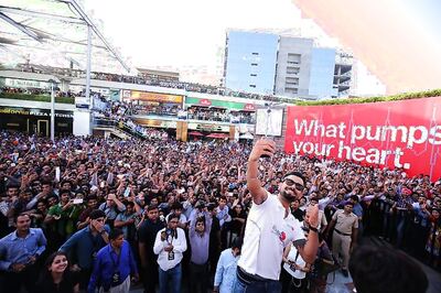 Snapshot: Virat Kohli rocks a new look while posing for selfies with fans