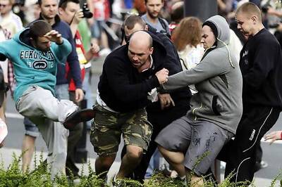 Poland sorry for clashes, wants harsh penalties