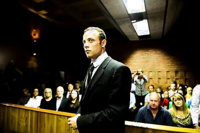 Pistorius forced out of hiding for trial hearing