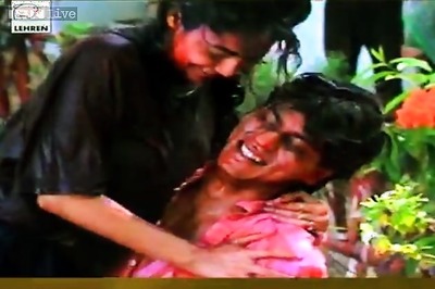 Watch: Shah Rukh hugs Gauri, then dunks her in a coloured pool of water in this video from a private Holi party in the '90s