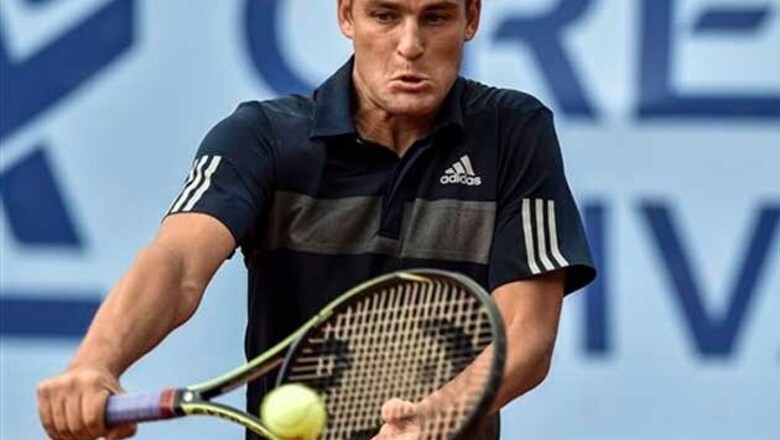Titleholder Mikhail Youzhny advances at Swiss Open
