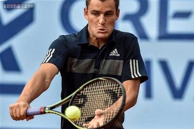 Titleholder Mikhail Youzhny advances at Swiss Open