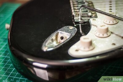 How to Tighten a Loose Input Jack on a Stratocaster Guitar
