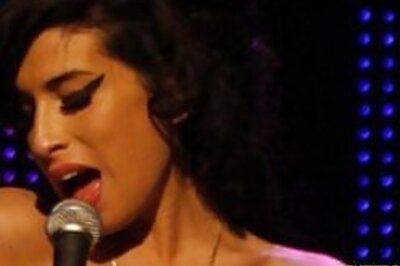 Amy Winehouse taken to hospital after fainting spell