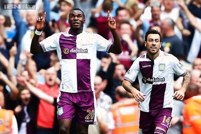 Villa stun Arsenal, Liverpool ride luck to win