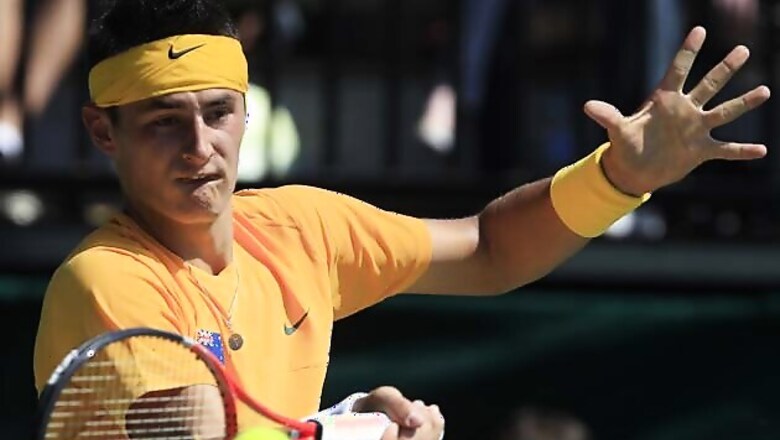 Tomic advances to round three after tough win