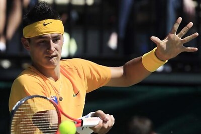 Tomic advances to round three after tough win