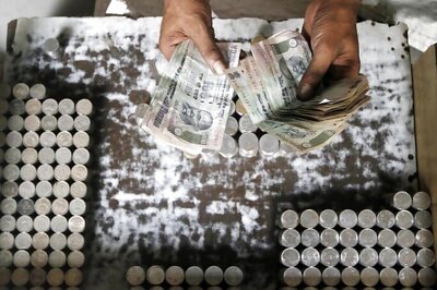 Rupee at 29-month low, sinks 7 paise vs dollar in early trade