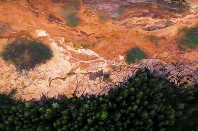 Streams of Acid from Abandoned Russian Mine Burn Mountains Yellow and Red