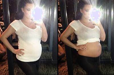 Finally! Kim Kardashian shows her bare baby bump