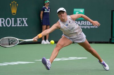 Defending Champion Iga Swiatek Races into Indian Wells 3rd Round, Fritz Fights Through