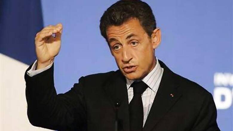 Hollande tops Sarkozy in French vote, Le Pen surges