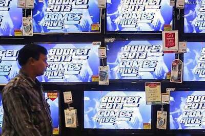 Govt unveils new taxes on super rich in Budget 2013