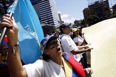 Venezuelans hold rival marches for and against government