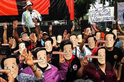 Thailand Activists in Pinocchio Masks Call Junta Leader 'Liar'
