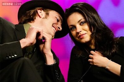 Ashton Kutcher,  Mila Kunis get cosy during a basketball match